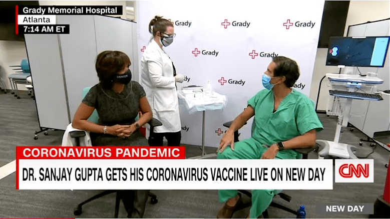 Dr. Sanjay Gupta Gets His COVID-19 Vaccine at Grady Memorial – while Jaco EVO Looks On